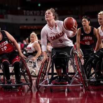 A Canadian wheelchair basketball player in an intense match, highlighting adaptive sports medical equipment